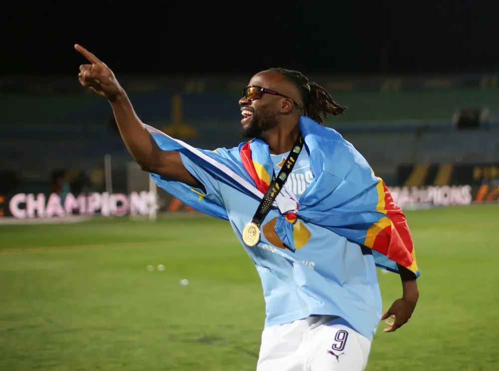Fiston Mayele celebrating with a medal and DR Congo flag